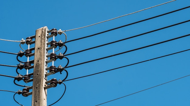 Electric pole or lamp pole with blur sky background.