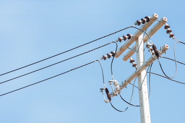 Electric poles on blue sky