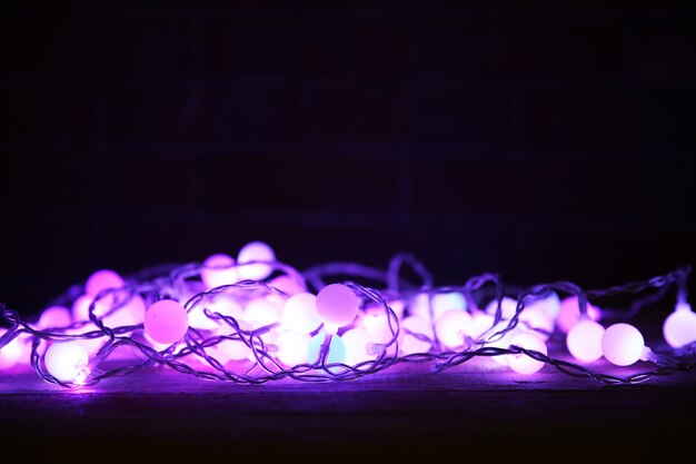 Electric purple garland on black background