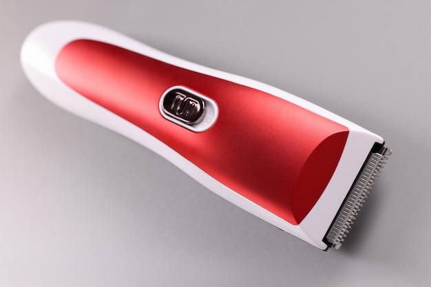 Electric razor for cutting hair on gray background