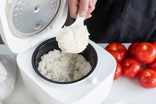 electric rice cooker on wooden countertop in the kitchen