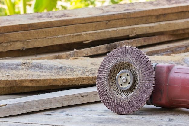 Electric sandpaper tool on wooden table