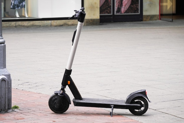 Electric scooter or escooter parked on pedestrian street