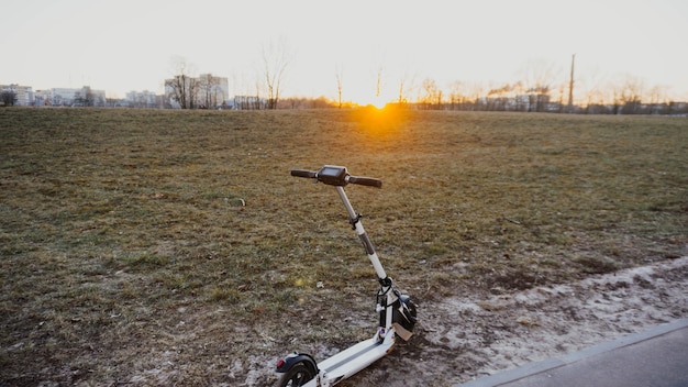 electric scooter for a walk in the evening at sunset