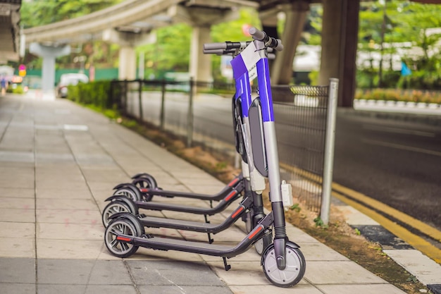 Electric scooters for rent urban transport Electric Ride Sharing Scooters Lined Up and Ready to Rent