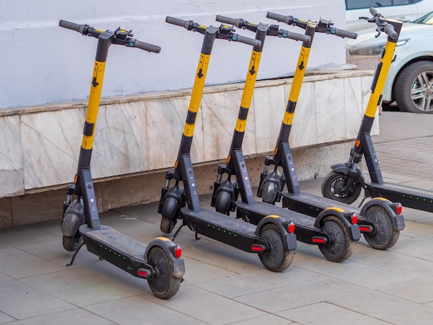 Photo electric scooters-sharing service on the city streets