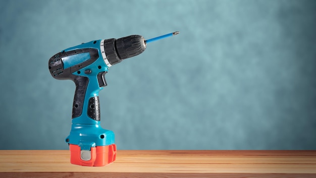 Premium Photo | Electric screwdriver on the table