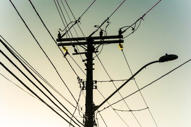 Electric and telephone cables and wires on a pole in the streets of the metropolis. Salvador, Bahia, Brazil.