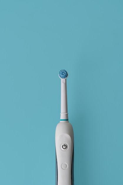 Electric toothbrush. modern rechargeable sonic or electric\
toothbrush on isolated background. concep