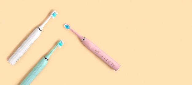 Electric Toothbrush Top View Flat Lay Copy Space Dental Care Supplies on Beige Pastel Studio Background Oral Hygiene Gum Health Healthy Teeth Modern Dental Ultrasonic Vibration Tooth Brush Set