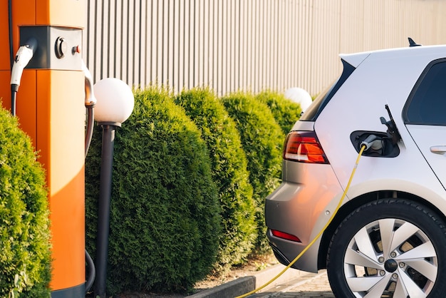 Electric vehicle and bus charging points shot of modern electric power charging station for ev