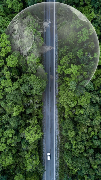 Photo electric vehicle car going through forest ev electrical energy for environment nature power technology sustainable devlopment goals green energy ecosystem ecology healthy environment road trip