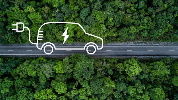 Electric vehicle car going through forest EV electrical energy for environment Nature power technology sustainable devlopment goals green energy Ecosystem ecology healthy environment road trip
