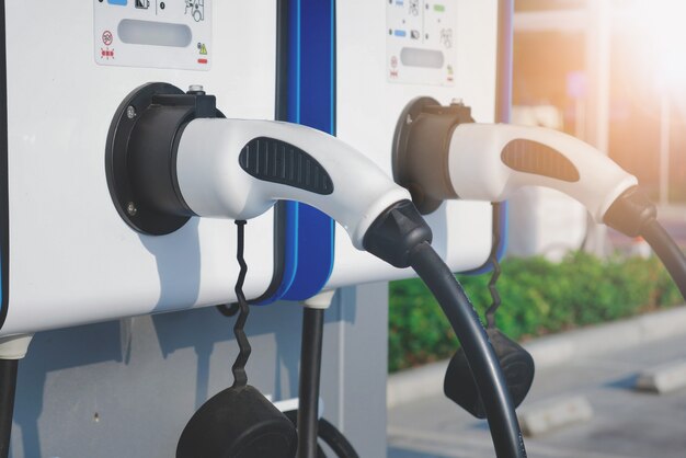 Electric vehicle charging (Ev) station with power cable plug.