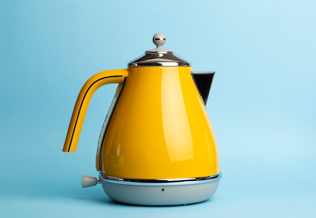 Photo electric vintage retro kettle on a colored blue. lifestyle and design concept