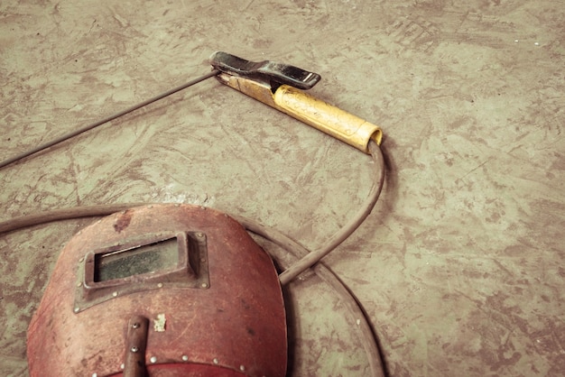 Electric welding machine, electric wire, masks, gloves and tongs, are very old