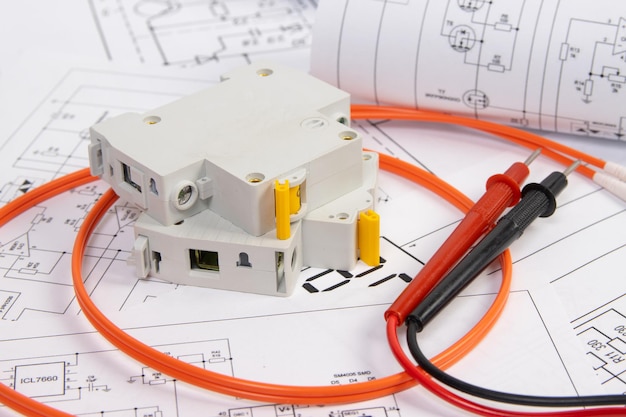 Electrical circuit breaker, wires and paper electrical engineering drawings