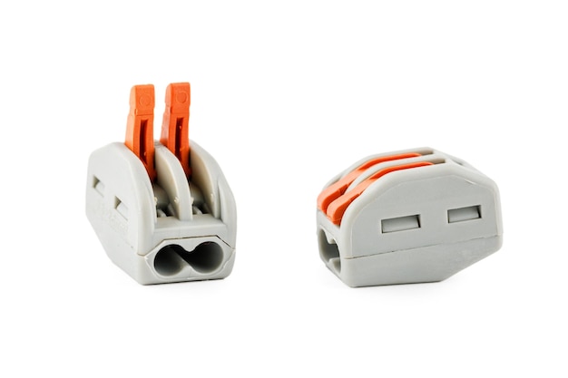 Photo electrical connector terminal block clips for electrical cables on a white background