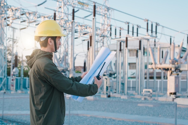 Electrical engineer standing at the power substation