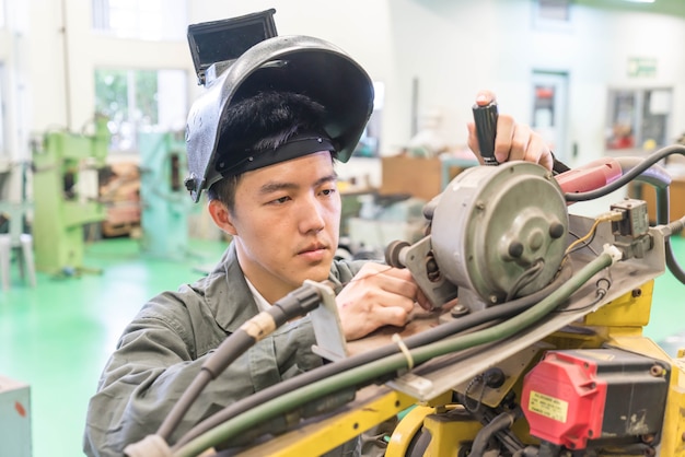 Electrical engineer working with a robot machine