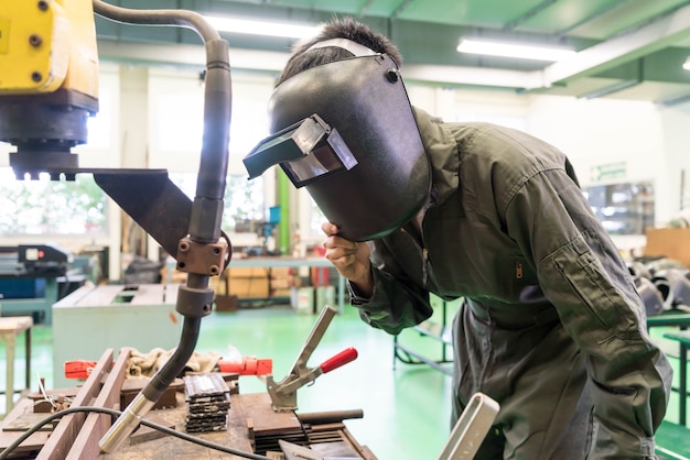 Electrical engineer working with a robot machine