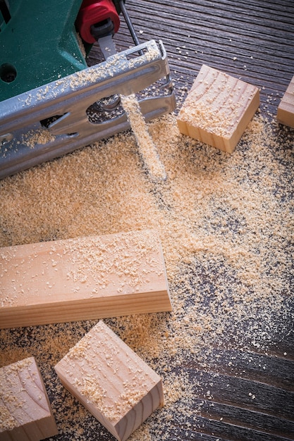 Electrical fretsaw sawdust and wooden bricks