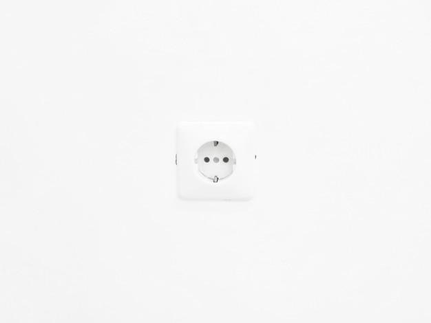 Photo electrical outlet on white wall