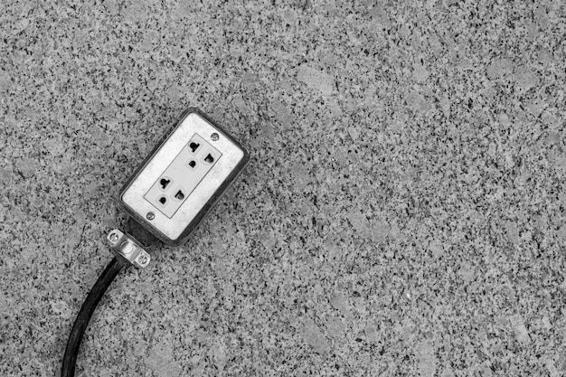 Electrical sockets on the floor at construction site.