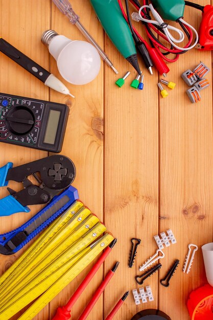 electrical tools and components on wooden background
