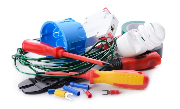 Electrician's supplies on white background