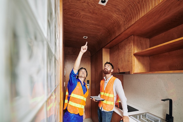 Electrician showing installed bulb sockets