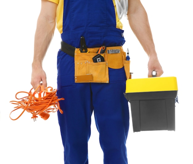 Electrician with bunch of wires and toolbox on white