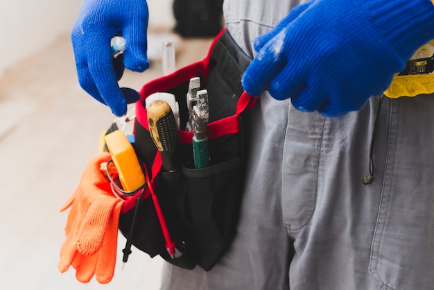 Photo electrician with tools on belt