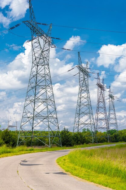 Electricity pylon on field against sky