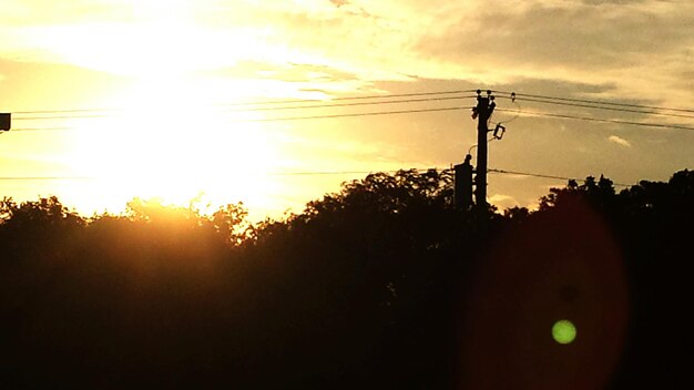 Photo electricity pylon at sunset