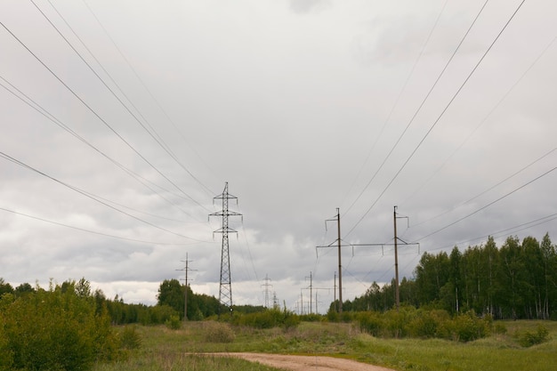 Electricity pylons and lines in rural, wide angle