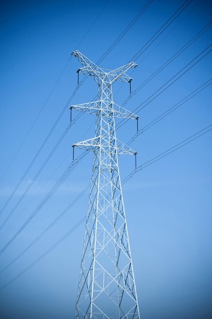 Electricity pylons in sky