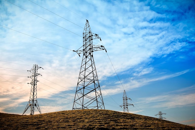 Electricity pylons view during the sunset