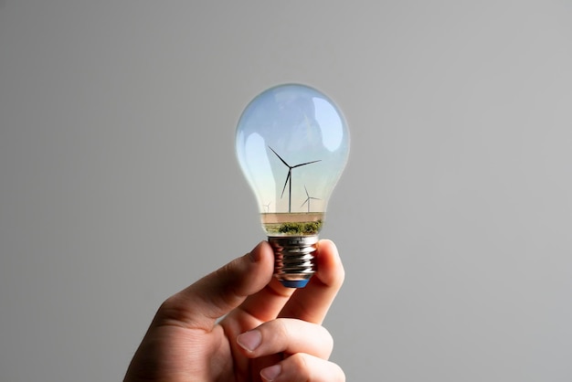 An electricity windmill inside the light bulb as the symbol of ecofriendly technology