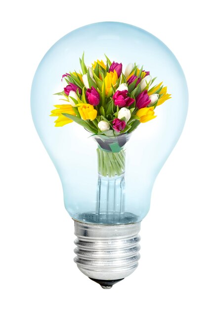 Photo electrobulb with a bunch of flowers tulips on a white background...