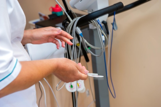 Electrocardiogram ECG in hand Clinic of Cardiology heart rate and pulse test closeup