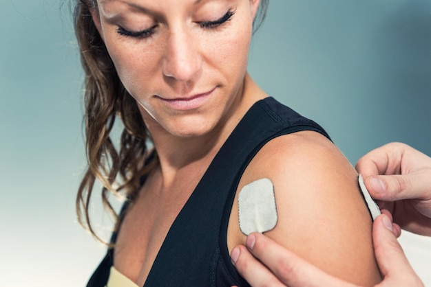 Photo electrodes of tens device on human shoulder