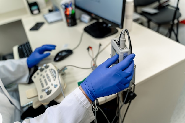 Electromyography in doctor s hands. Medical examination. EMG. Selective focus.