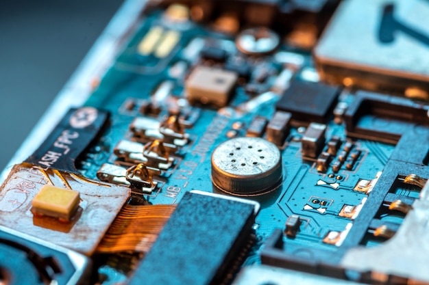 Photo electronic board of phone with semiconductor elements close up