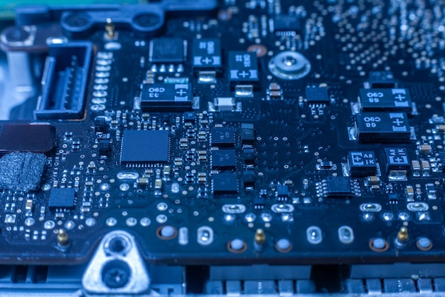 Electronic chip and SMD components on blue circuit board