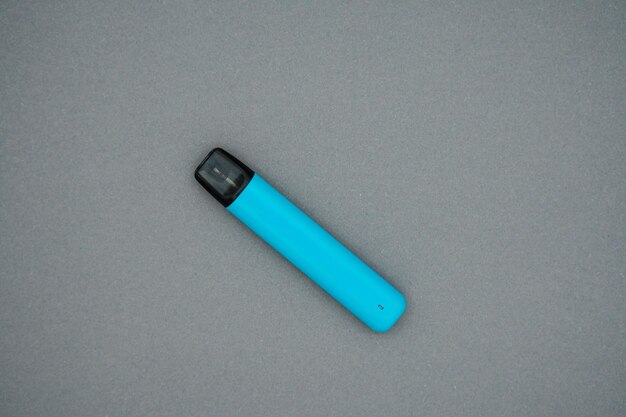 Electronic cigaret isolated on gray. Top view