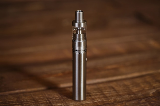 Electronic cigarette on a wooden table.