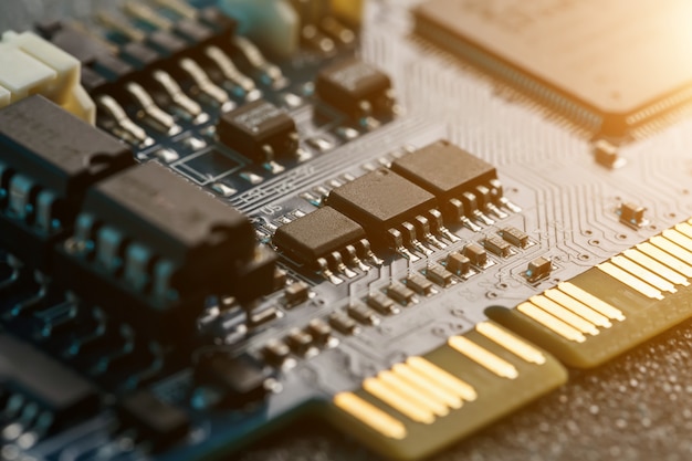 Electronic circuit board close up, processor, chips and capacitors.