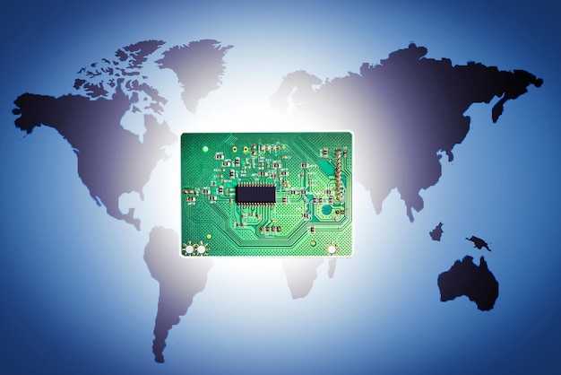 Electronic circuit board on world map background Concept of production of electronics microchip motheboard cpu