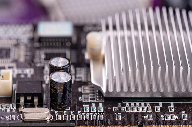 Electronic circuit and cooling fin at computer video card stack with used video cards closeup